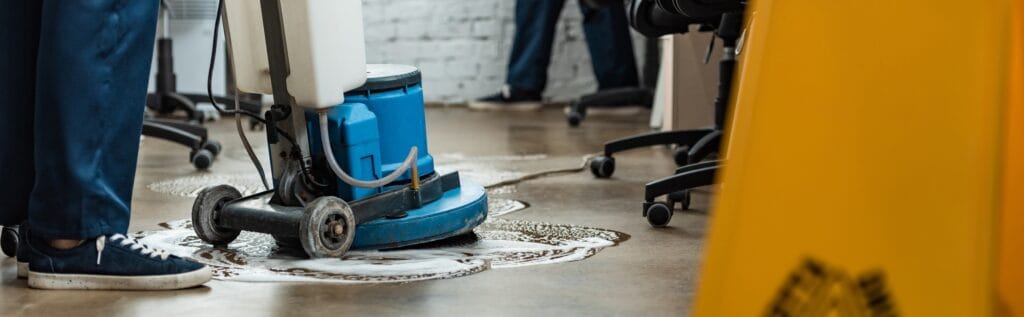 cropped view of cleaner washing floor with cleaning machine, panoramic shot