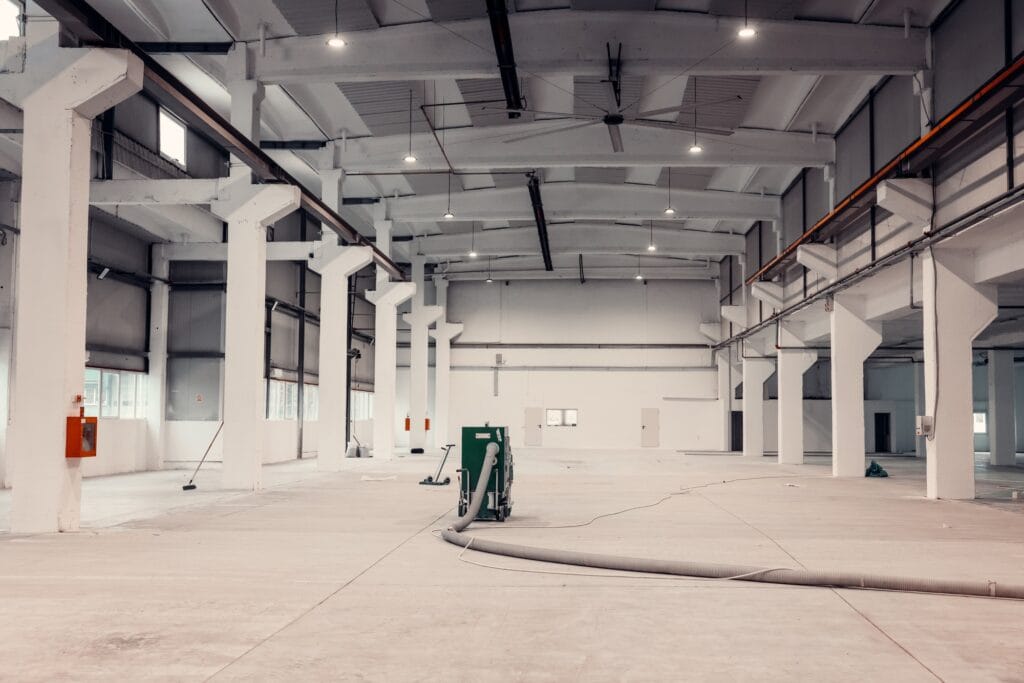 Work in progress in an industrial warehouse. Industrial vacuum cleaner